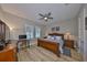 Cozy bedroom with wooden furniture, natural light, and a dedicated desk area for work or study at 715 Pinckney Dr, Apollo Beach, FL 33572
