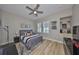 Cozy bedroom featuring a gray bed frame, work space and natural light at 715 Pinckney Dr, Apollo Beach, FL 33572
