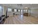 Bright bonus room features a ceiling fan, media console, and exercise equipment at 715 Pinckney Dr, Apollo Beach, FL 33572