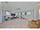 Bright bonus room features a ceiling fan, media console, exercise equipment, and multiple windows at 715 Pinckney Dr, Apollo Beach, FL 33572