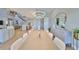 Dining area with modern chandelier, large table, and views of the canal at 715 Pinckney Dr, Apollo Beach, FL 33572