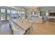 A dining area featuring a view of the canal, modern lighting, and comfortable seating at 715 Pinckney Dr, Apollo Beach, FL 33572