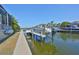 Private dock showcasing a boat lift and access to open water, promising endless aquatic adventures at 715 Pinckney Dr, Apollo Beach, FL 33572
