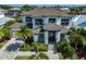 Grand two-story home boasts meticulous landscaping and a neutral palette, creating an inviting curb appeal at 715 Pinckney Dr, Apollo Beach, FL 33572