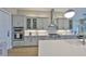 Stylish kitchen featuring stainless steel appliances, custom cabinetry, and elegant lighting for a gourmet cooking experience at 715 Pinckney Dr, Apollo Beach, FL 33572