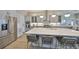 Modern kitchen with stainless steel appliances and quartz countertops, complemented by an inviting island at 715 Pinckney Dr, Apollo Beach, FL 33572