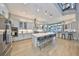 A spacious kitchen with a large island, stainless steel appliances, and wooden floors at 715 Pinckney Dr, Apollo Beach, FL 33572