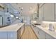 Open kitchen boasts stainless steel appliances, quartz countertops, and a spacious layout perfect for entertaining at 715 Pinckney Dr, Apollo Beach, FL 33572
