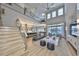Bright living room with modern decor, two-story windows, and open floor plan at 715 Pinckney Dr, Apollo Beach, FL 33572
