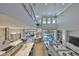 A living room with an open floor plan, high ceilings and large windows with a view at 715 Pinckney Dr, Apollo Beach, FL 33572