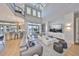 Bright, spacious living room with a high ceiling, modern decor, and seamless indoor-outdoor living spaces at 715 Pinckney Dr, Apollo Beach, FL 33572