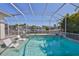 Refreshing pool and canal, featuring clear water and lounge chairs for enjoying the sun at 715 Pinckney Dr, Apollo Beach, FL 33572