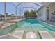 Inviting pool with integrated lounge area and a clear view of the peaceful waterway at 715 Pinckney Dr, Apollo Beach, FL 33572