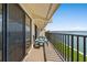 This balcony features a charming seating area and stunning ocean views, perfect for relaxation at 7540 Sunshine Skyway S Ln # 219, St Petersburg, FL 33711