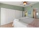 Spacious bedroom with large closets, ensuite bathroom, and light green walls at 7540 Sunshine Skyway S Ln # 219, St Petersburg, FL 33711