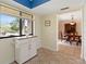 Bright breakfast nook next to the kitchen with tiled floors and large windows with views at 7540 Sunshine Skyway S Ln # 219, St Petersburg, FL 33711