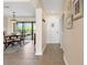 Charming dining area featuring a modern light fixture and easy access to the outdoors through sliding glass doors at 7540 Sunshine Skyway S Ln # 219, St Petersburg, FL 33711