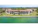 Waterfront condo community with balconies, lush landscaping, and easy access to the water at 7540 Sunshine Skyway S Ln # 219, St Petersburg, FL 33711