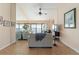Comfortable living room with tile floors, neutral sofas, and views of the water at 7540 Sunshine Skyway S Ln # 219, St Petersburg, FL 33711