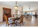 Cozy living space featuring dining area, living room with water views, and neutral-toned tile floors at 7540 Sunshine Skyway S Ln # 219, St Petersburg, FL 33711