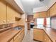 Functional kitchen with ample cabinetry, classic appliances, and an adjacent dining area at 8014 N Lynn Ave, Tampa, FL 33604