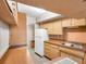Well-arranged kitchen featuring classic cabinets, essential appliances, and efficient layout at 8014 N Lynn Ave, Tampa, FL 33604