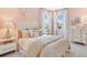 Charming bedroom with pink walls, butterfly decor, and elegant furnishings at 841 Steel Dr, Apollo Beach, FL 33572