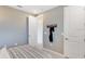 Neutral bedroom with a locker room theme, featuring a comfortable bed and minimalist decor at 841 Steel Dr, Apollo Beach, FL 33572