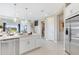 The kitchen island features pendant lighting and ample counter seating at 841 Steel Dr, Apollo Beach, FL 33572