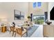 A bright living room with neutral decor and a view of the backyard at 841 Steel Dr, Apollo Beach, FL 33572