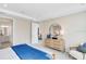 Cozy bedroom with a dresser and an adjacent door to the bathroom and living area at 841 Steel Dr, Apollo Beach, FL 33572
