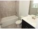 Bathroom with shower and tub combination, single sink vanity and neutral wall color at 843 Steel Dr, Apollo Beach, FL 33572