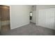 Neutral-toned bedroom with carpet flooring, closet and adjoining bathroom view at 843 Steel Dr, Apollo Beach, FL 33572