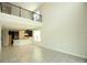 Spacious living room featuring a view of the kitchen and an upstairs loft area at 843 Steel Dr, Apollo Beach, FL 33572