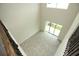 Spacious living room featuring a two-story ceiling, sliding glass doors and tile flooring at 843 Steel Dr, Apollo Beach, FL 33572