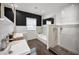 Modern bathroom with double sink vanity, bathtub, and tiled shower at 847 Highland N St, St Petersburg, FL 33701