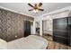 Nicely staged bedroom with decorative wall, barn door to bathroom, and mirrored closet doors at 847 Highland N St, St Petersburg, FL 33701