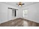 Bedroom featuring hardwood floors, built-in closet, window, and a ceiling fan at 847 Highland N St, St Petersburg, FL 33701
