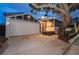 Charming home featuring a well-lit entrance, large garage, and mature tree offering curb appeal and character at 847 Highland N St, St Petersburg, FL 33701