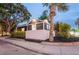 Charming exterior with gray siding, white trim, palm tree and professional landscaping at twilight at 847 Highland N St, St Petersburg, FL 33701
