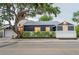 Well-manicured home exterior showing dark siding, white trim, garage and updated landscaping at 847 Highland N St, St Petersburg, FL 33701