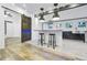 A bright kitchen featuring black bar stools and a butcher block island next to a sliding wood door at 847 Highland N St, St Petersburg, FL 33701