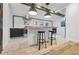 Contemporary kitchen featuring island with seating, modern lighting, and tile backsplash at 847 Highland N St, St Petersburg, FL 33701