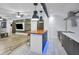 A large, bright kitchen and living area featuring an island with wood countertop and stainless steel appliances at 847 Highland N St, St Petersburg, FL 33701