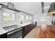 Stylish kitchen with white tile backsplash, stainless steel appliances, and sleek countertops at 847 Highland N St, St Petersburg, FL 33701