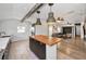 Open concept kitchen featuring island, modern appliances and seamless access to the living area at 847 Highland N St, St Petersburg, FL 33701