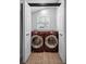 Laundry room with modern washer and dryer units, and natural light at 847 Highland N St, St Petersburg, FL 33701