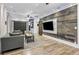 Spacious living room featuring wood wall, modern furnishings and open layout to the kitchen at 847 Highland N St, St Petersburg, FL 33701