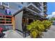 The Bier Boutique's covered outdoor seating area and facade, perfect for enjoying food and drinks in a lively atmosphere at 847 Highland N St, St Petersburg, FL 33701