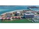 A stunning aerial perspective of a condo community near the water and a harbor, featuring a bridge and scenic views at 855 Bayway Blvd # 703, Clearwater Beach, FL 33767